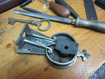Crab Lock on Bench with other parts and tools